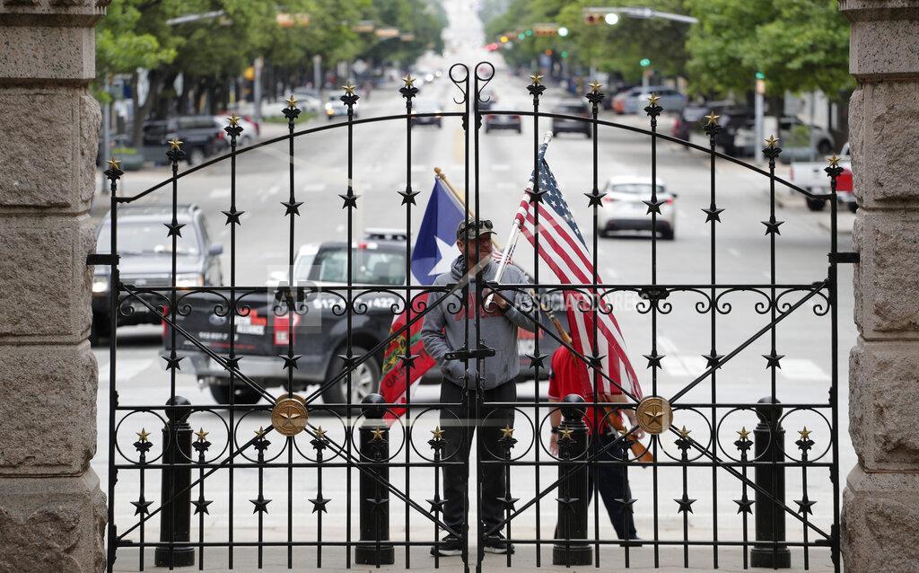 Eric Gay Protesters rally at the Texas State Capitol to speak out against Texas' handling of the COVID-19 outbreak, in Austin, Texas, Saturday, April 18, 2020. Austin and many other Texas cities remain under stay-at-home orders due to the COVID-19 outbreak except for essential personal. (AP Photo/Eric Gay)