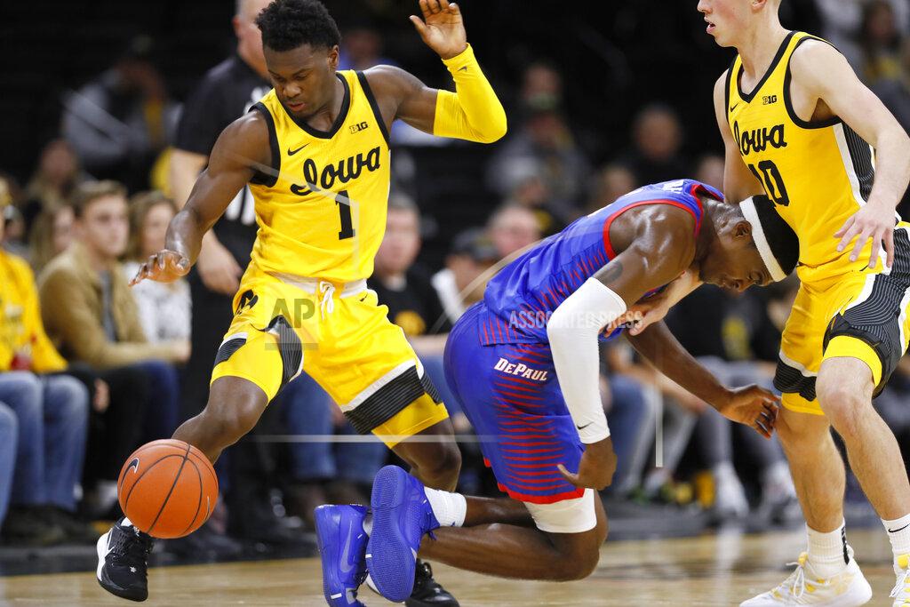 Charlie Neibergall Iowa guard Joe Toussaint (1) steals the ball from DePaul forward Paul Reed during the second half of an NCAA college basketball game, Monday, Nov. 11, 2019, in Iowa City, Iowa. DePaul won 93-78. (AP Photo/Charlie Neibergall)