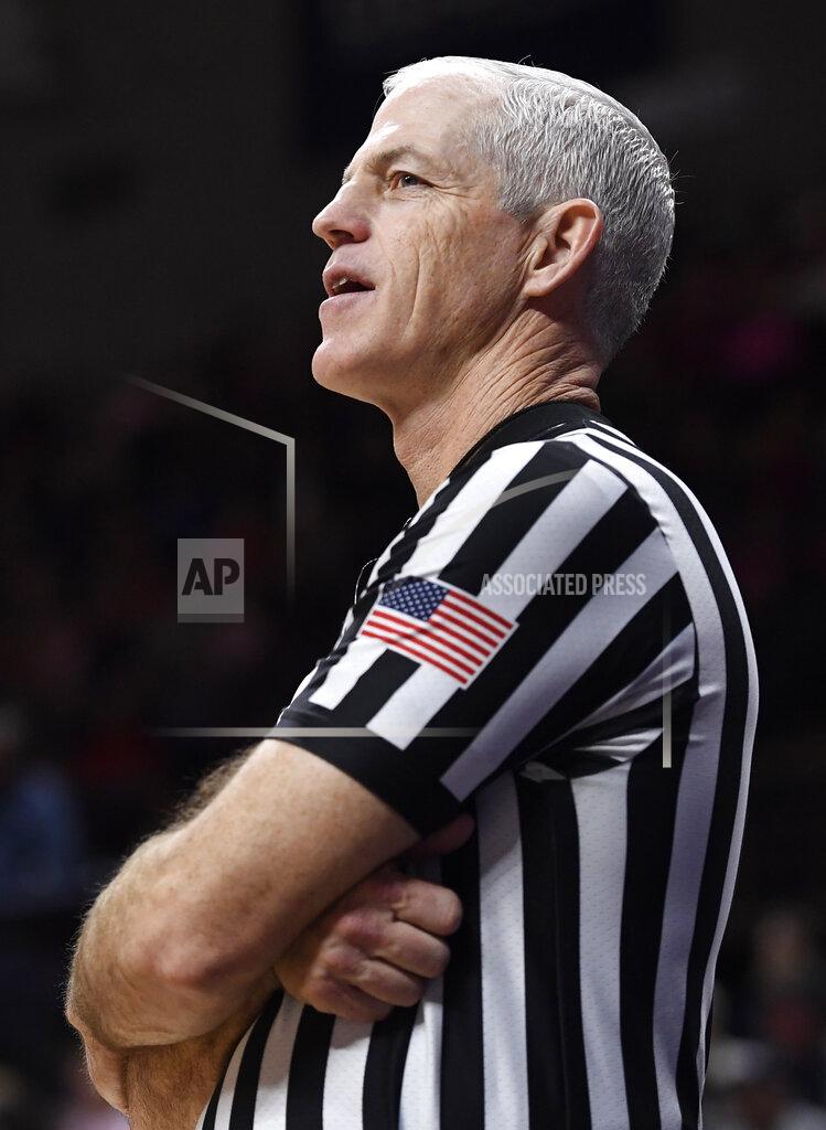 Jessica Hill Referee Bruce Morris officiates an NCAA college basketball game between Connecticut and Temple, Saturday, Feb. 9, 2019, in Storrs, Conn. Morris holds an NCAA record for the longest shot recorded.(AP Photo/Jessica Hill)