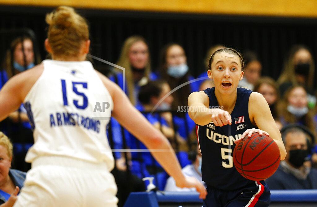 Noah K. Murray Connecticut guard Paige Bueckers (5) dribbles against Seton Hall guard Katie Armstrong (15) during the second half of an NCAA college basketball game on Friday, Dec. 3, 2021, in South Orange, N.J. (AP Photo/Noah K. Murray)