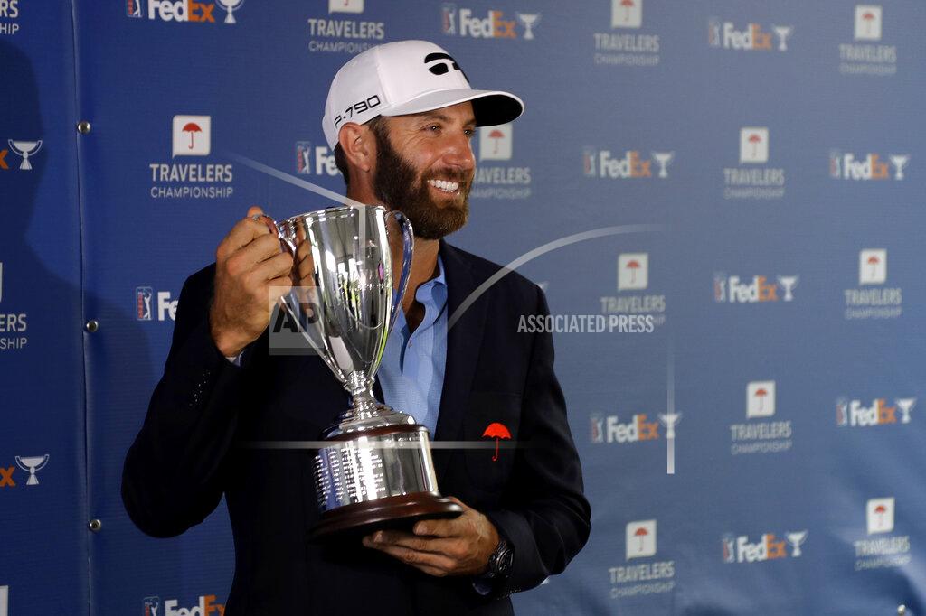 Frank Franklin Ii Dustin Johnson poses with the trophy after winning the Travelers Championship golf tournament at TPC River Highlands, Sunday, June 28, 2020, in Cromwell, Conn. (AP Photo/Frank Franklin II)