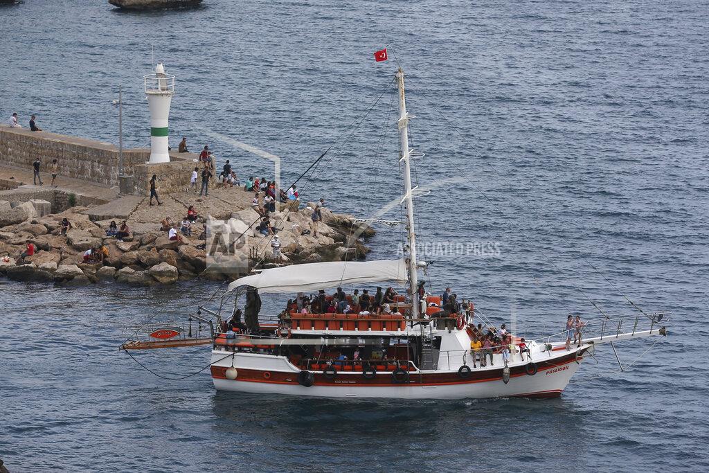 Emrah Gurel Tourist take a boat trip in Antalya, southern Turkey, Monday, June 21, 2021. Hotels in Turkey's Antalya region, a destination beloved by holidaymakers, are preparing to finally resume operations as they expect the return of international tourists after months of setbacks caused by the pandemic that halted travel. (AP Photo/Emrah Gurel)