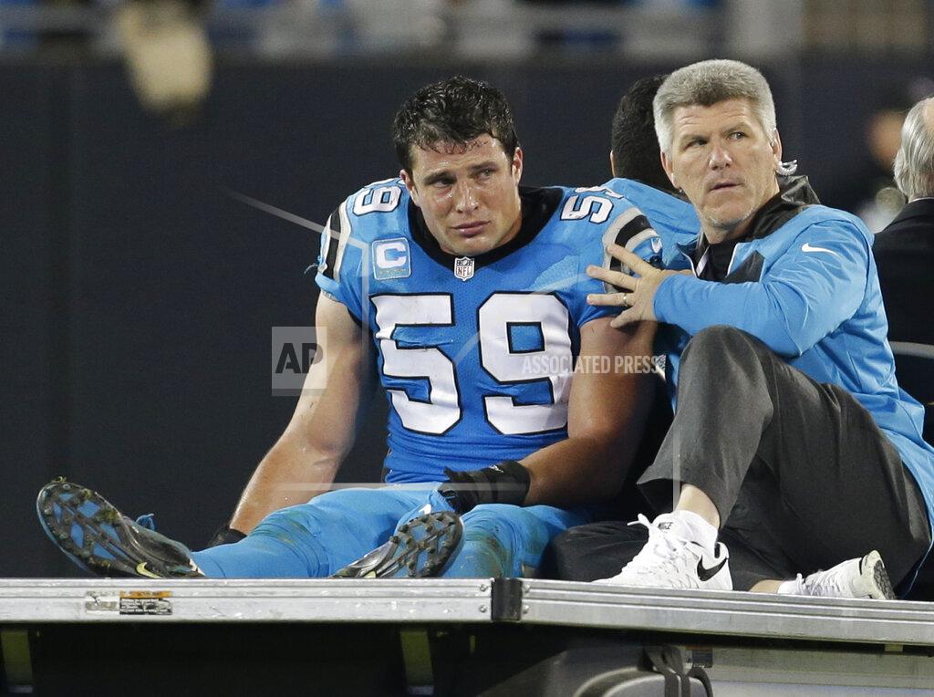 Bob Leverone FILE - In this Nov. 17, 2016, file photo, Carolina Panthers' Luke Kuechly (59) is taken off the field after being injured in the second half of an NFL football game against the New Orleans Saints, in Charlotte, N.C. Panthers linebacker Luke Kuechly is retiring from the NFL after eight seasons. The 28-year-old Kuechly made the surprising announcement Tuesday, Jan. 14, 2020, on the team’s website. (AP Photo/Bob Leverone, File)