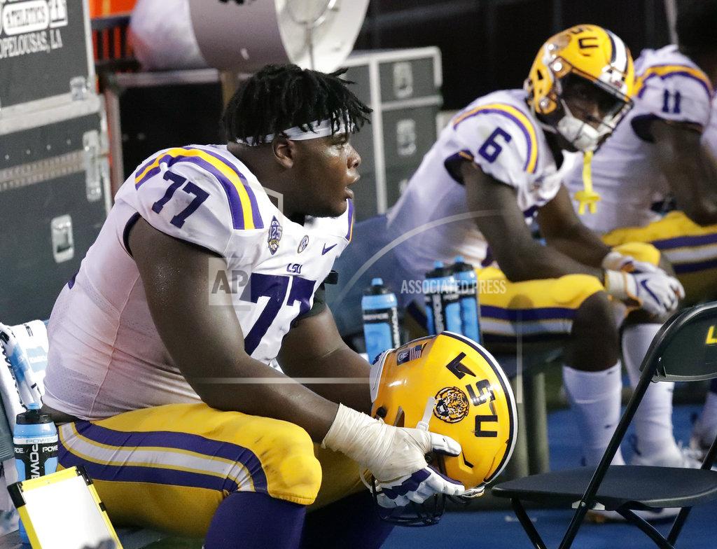 John Raoux LSU offensive tackle Saahdiq Charles (77) and wide receiver Terrace Marshall Jr. (6) sit on the bench after the team's 27=19 loss to Florida in an NCAA college football game Saturday, Oct. 6, 2018, in Gainesville, Fla. (AP Photo/John Raoux)