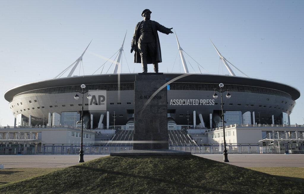 Dmitri Lovetsky A sculpture of one of Bolshevik's leader Sergei Kirov stands in font of the Saint-Petersburg Arena in St.Petersburg, Russia Tuesday, Feb. 4, 2020. With coronavirus restrictions eased to allow fans back into stadiums, there at least will be some atmosphere at the tournament after months of games being played without any. Budapest wants all fans to come, while Saint Petersburg and Baku hope to use 50% of stadium capacity. (AP Photo/Dmitri Lovetsky)