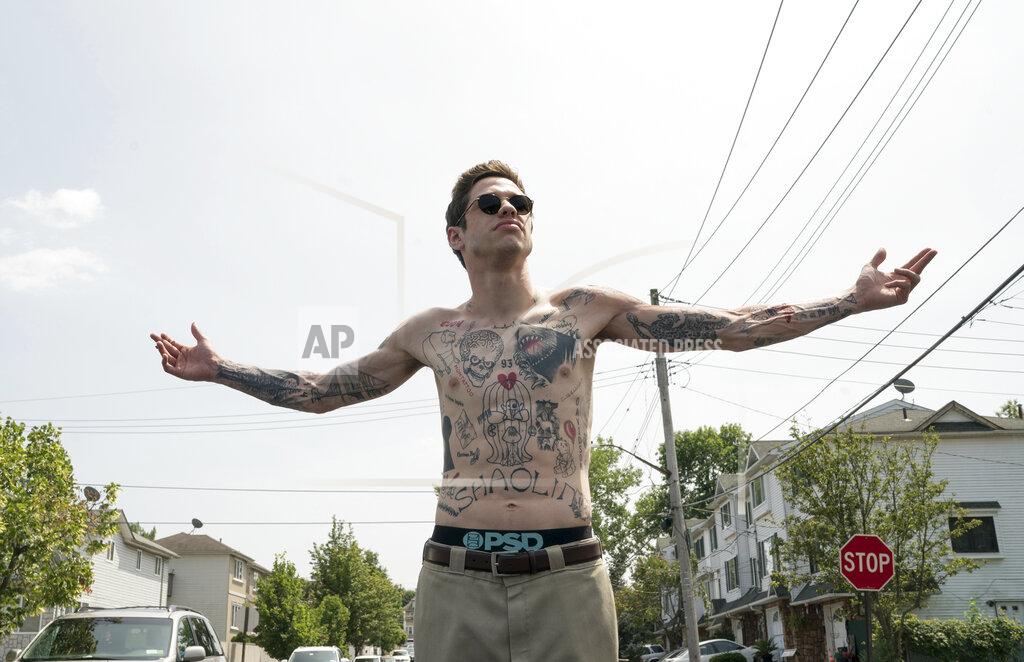 Mary Cybulski In this image released by Universal Pictures, Pete Davidson appears in a scene from "The King of Staten Island," directed by Judd Apatow. (Mary Cybulski/Universal Pictures via AP)