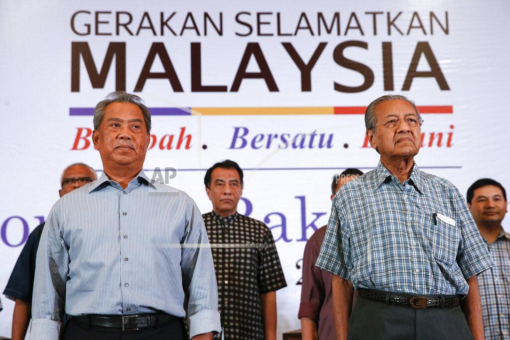 Vincent Thian FILE - In this March 27, 2016, file photo, Malaysia's former Prime Minister Mahathir Mohamad, right, and former Deputy Prime Minster Muhyiddin Yassin attend the "People's Congress 2016" event in Shah Alam, Malaysia. Malaysian ex-Prime Minister Mahathir has been ousted from his Malay party in the latest twist to a power struggle with his successor Muhyiddin Yassin, but he has vowed to challenge it. (AP Photo/Vincent Thian, File)