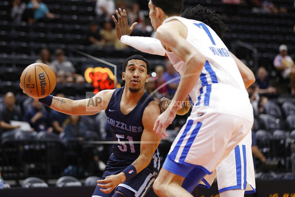 Jeff Swinger Memphis Grizzlies guard Tremont Waters (51) is defended by Oklahoma City Thunder forward Chet Holmgren (7) and another player during the first half of an NBA summer league basketball game Wednesday, July 6, 2022, in Salt Lake City. (AP Photo/Jeff Swinger)