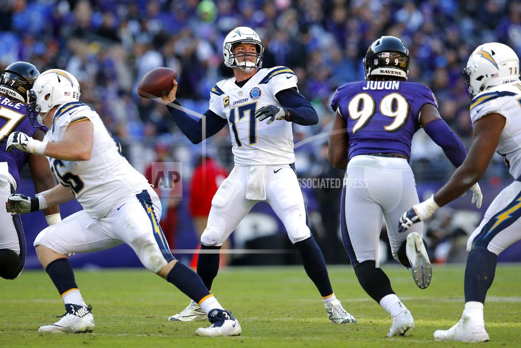 Carolyn Kaster Los Angeles Chargers quarterback Philip Rivers (17) throws a pass in the second half of an NFL wild card playoff football game against the Baltimore Ravens, Sunday, Jan. 6, 2019, in Baltimore. (AP Photo/Carolyn Kaster)
