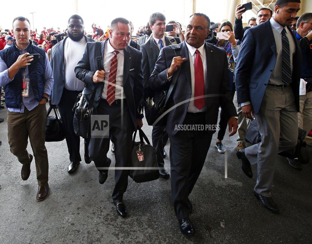 Wade Payne Former Tennessee head football coach Butch Jones, third from left, arrives before an NCAA college football game between Alabama and Tennessee Saturday, Oct. 20, 2018, in Knoxville, Tenn. (AP Photo/Wade Payne)