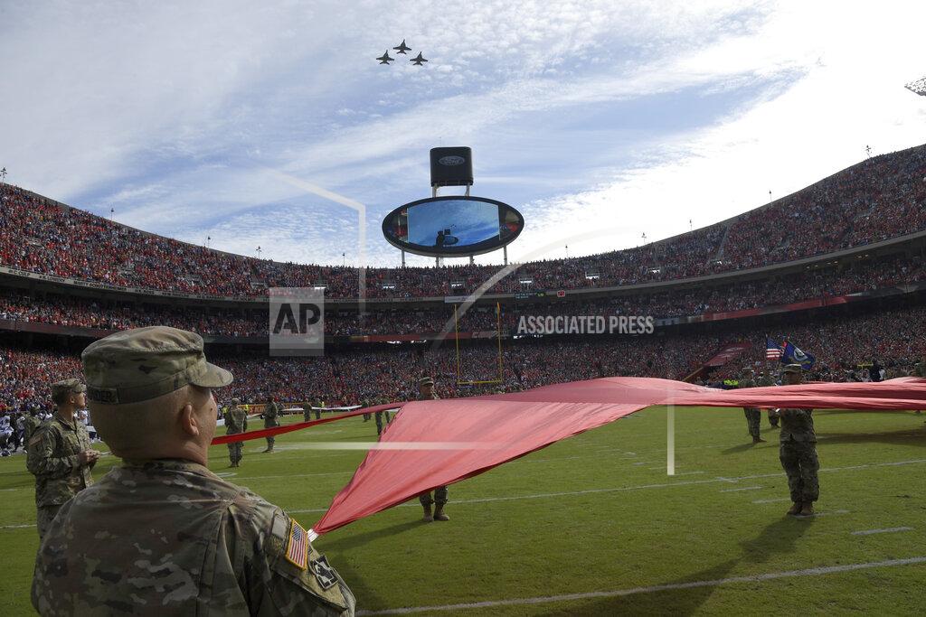 Reed Hoffmann Service members hold a star as three F-18 jets fly above before the first half of an NFL football game in Kansas City, Mo., Sunday, Nov. 3, 2019. (AP Photo/Reed Hoffmann)