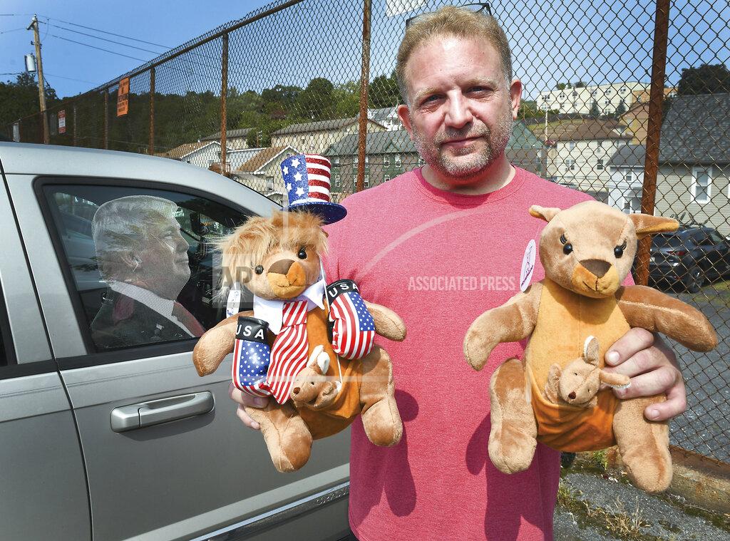 Keith Haupt Ben Philips shows off two of his Trump kangaroos outside his apartment in Bloomsburg, Pa., Wednesday, Sept. 19, 2020. Philips is one of the people who died of a medical emergency during the storming of the Capitol on Wednesday, Jan. 6, 2021. He was the founder of a pro-Trump social media site called Trumparoo and had coordinated transportation for several dozen people from Pennsylvania to Washington. (Keith Haupt/Bloomsburg Press Enterprise via AP)