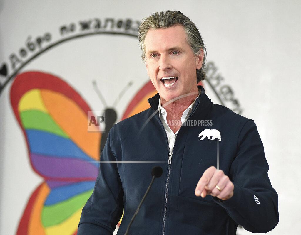 FILE - In this Feb. 26, 2021, file photo, California Gov. Gavin Newsom speaks during a press conference, after visiting a COVID-19 vaccination clinic for farmworkers at the Dr. Sharon Stanley-Rea Community Center in Fresno, Calif. Gov. Newsom is set to give perhaps the most important speech of his political life Tuesday, March 9, and he’s spent weeks laying the groundwork for an upbeat address aimed at nearly 40 million people exhausted by a year of coronavirus restrictions. (John Walker/The Fresno Bee via AP, File)