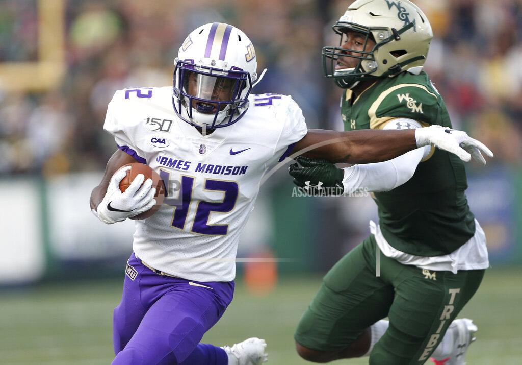 Daniel Sangjib Min James Madison's Solomon Vanhorse (42) runs away from William & Mary's Isaiah Laster, right, during the first half of an NCAA college football game in Williamsburg, Va., on Saturday, Oct. 19, 2019. (Daniel Sangjib Min/Richmond Times-Dispatch via AP)