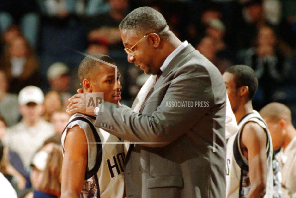 Porter Binks FILE - In this Jan. 24, 1996, file photo, Georgetown head coach John Thompson talks to Allen Iverson during an NCAA college basketball game against St. John's, in Landover, Md. Thompson, the imposing Hall of Famer who turned Georgetown into a basketball powerhouse and became the first Black coach to lead a team to the NCAA men’s title, has died at age 78, his family announced through the university, Monday, Aug. 31, 2020. (Porter Binks/USA Today via AP, File)