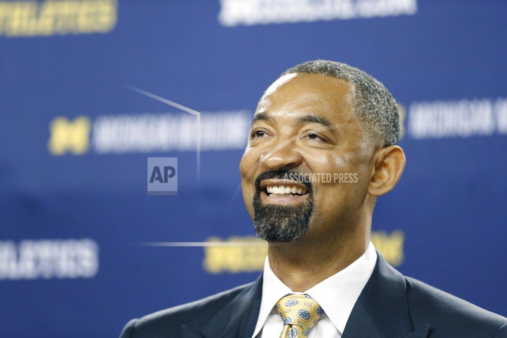 Carlos Osorio Juwan Howard smiles during his introduction as Michigan's new men's basketball coach, Thursday, May 30, 2019 in Ann Arbor, Mich. The former member of the Fab Five has a five-year contract that will pay him $2 million in his first year. The former Miami Heat assistant coach replaces John Beilein, who left to coach the Cleveland Cavaliers. (AP Photo/Carlos Osorio)