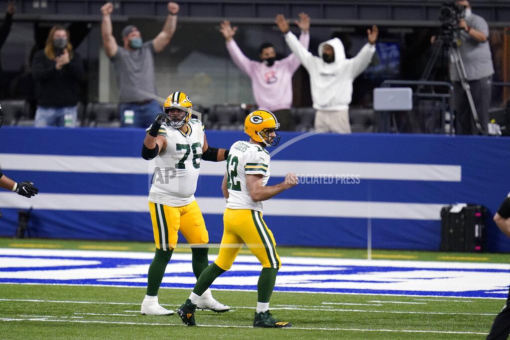 Michael Conroy Green Bay Packers quarterback Aaron Rodgers (12) celebrates after a touchdown pass during the first half of an NFL football game against the Indianapolis Colts, Sunday, Nov. 22, 2020, in Indianapolis. (AP Photo/Michael Conroy)