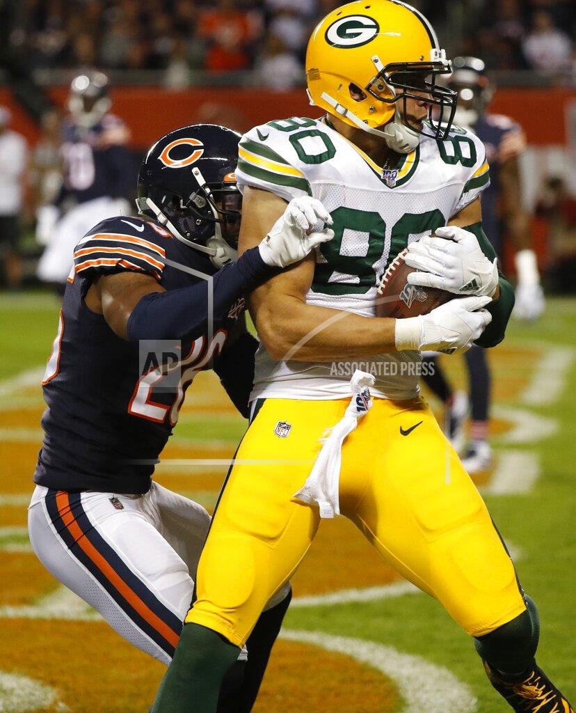 Charles Rex Arbogast Green Bay Packers' Jimmy Graham catches a touchdown pass in front of Chicago Bears' Deon Bush during the first half of an NFL football game Thursday, Sept. 5, 2019, in Chicago. (AP Photo/Charles Rex Arbogast)