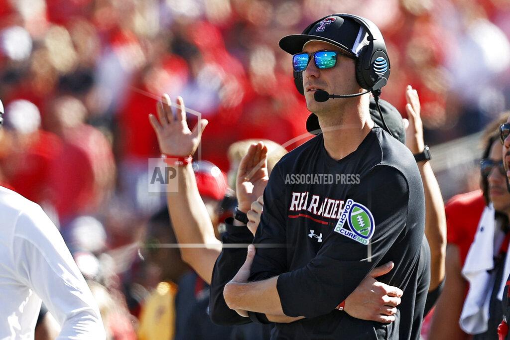 Brad Tollefson FILE - Texas Tech offensive coordinator Zach Kittley watches from the sidelines during the second half of an NCAA college football game against Texas, on Saturday, Sept. 24, 2022, in Lubbock, Texas. Kittley is the son of the longtime Texas Tech track coach and NCAA championship winner Wes Kittley. The younger Kittley was always consumed by football growing up. (AP Photo/Brad Tollefson, File)