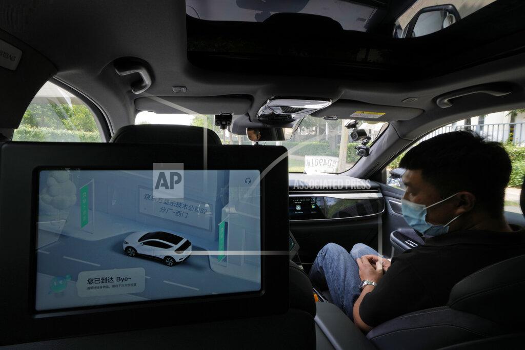 Ng Han Guan A screen provides a visualisation of the environment around the self-driving taxi developed by tech giant Baidu Inc. on June 14, 2022, in Beijing. Baidu Inc. is China's highest-profile competitor in a multibillion-dollar race with Alphabet Inc.'s Waymo and General Motors Co.'s Cruise to create self-driving cars. (AP Photo/Ng Han Guan)