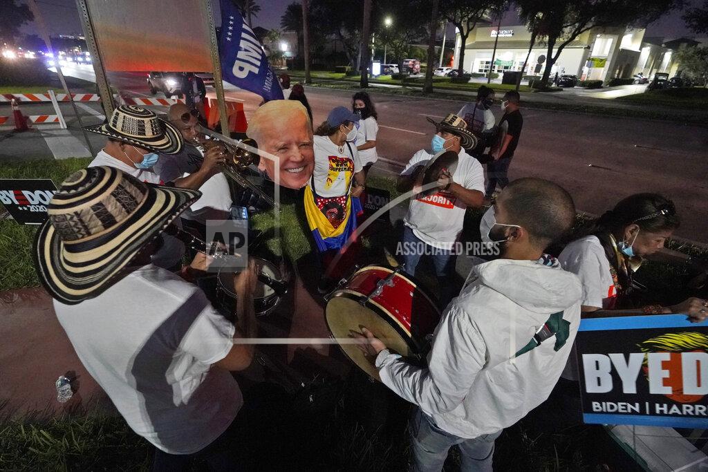 Wilfredo Lee A band plays a pro Joe Biden song, Tuesday, Nov. 3, 2020, outside the Miami-Dade County Elections Department in Doral, Fla. (AP Photo/Wilfredo Lee)
