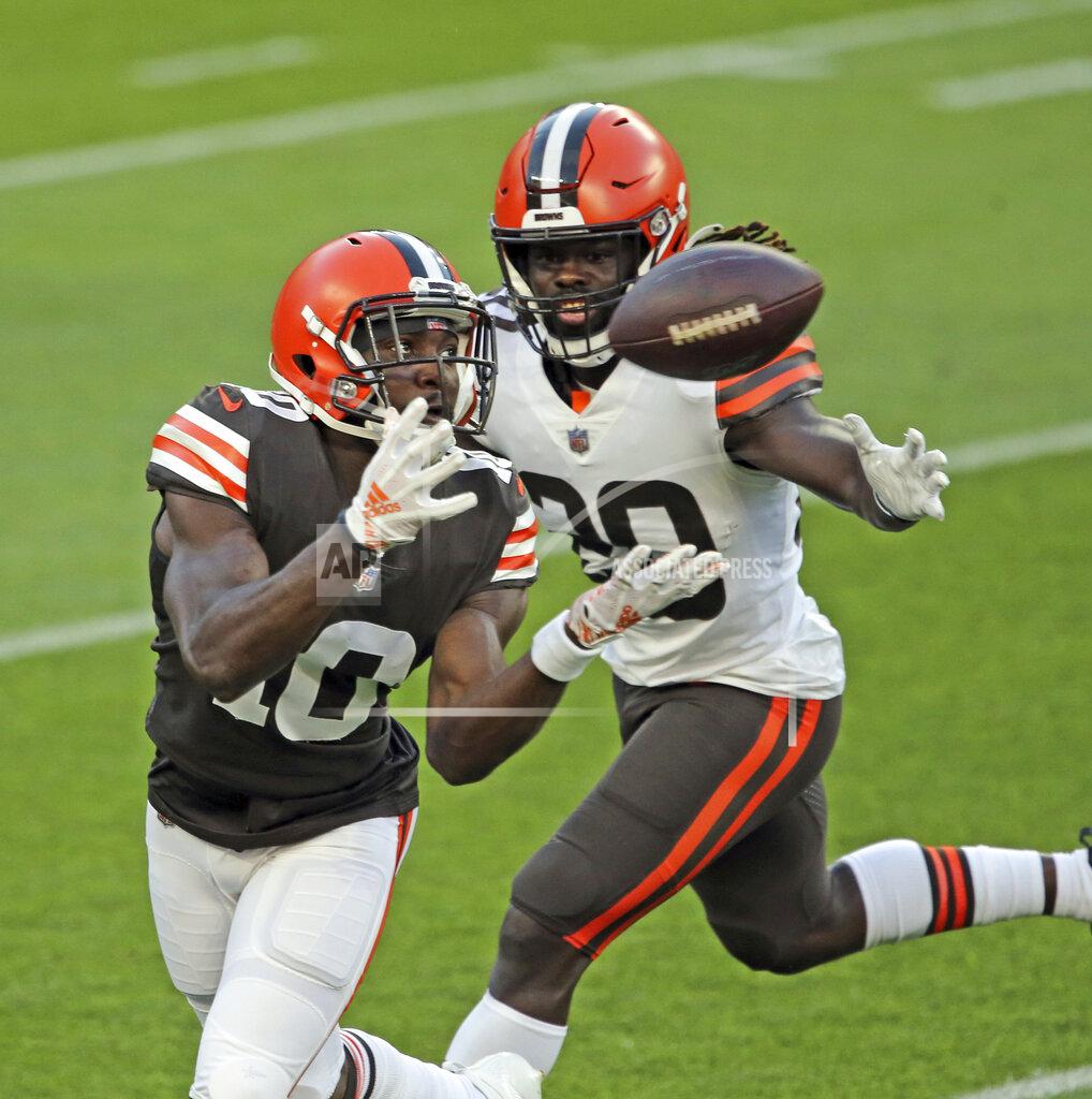 Joshua Gunter Cleveland Browns wide receiver Taywan Taylor catches a pass next to cornerback Tavierre Thomas during the NFL football team's scrimmage Friday, Sept. 4, 2020, in Cleveland. (Joshua Gunter/Cleveland.com via AP)
