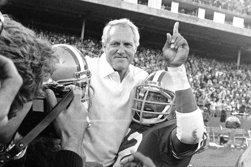 Paul Sakuma FILE - In this Nov. 29, 1981, file photo, San Francisco 49ers coach Bill Walsh is carried off the field by his team after beating the New York Giants 17-10 to clinch the division title at Candlestick Park in San Francisco. A pair of Super Bowl winning teams that launched dynasties in San Francisco and New England highlighted the list of the NFL's greatest teams, numbers 31-100. Coming in at No. 31 was the 1981 San Francisco 49ers led by coach Bill Walsh and quarterback Joe Montana. (AP Photo/Paul Sakuma, File)
