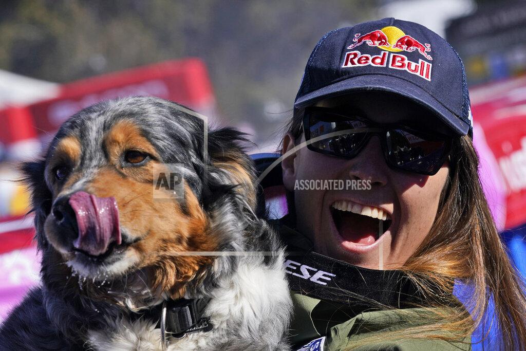Giovanni Auletta Italy's Sofia Goggia holds her dog after completing an alpine ski, women's World Cup downhill race, in Crans Montana, Switzerland, Sunday, Feb. 27, 2022. (AP Photo/Giovanni Auletta)
