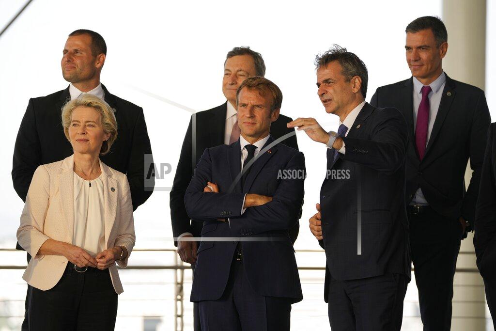 Thanassis Stavrakis Greek Prime Minister Kyriakos Mitsotakis, right, shows the view of the Greek capital to French President Emmanuel Macron, center, European Commission President Ursula von der Leyen, left, Maltese Prime Minister Robert Abela, left background, Italian Prime Minister Mario Draghi, center background, and Spanish Prime Minister Pedro Sanchez during the EUMED 9 summit at the Stavros Niarchos Foundation Cultural Center in Athens, Friday, Sept. 17, 2021. Nine European countries on the Mediterranean are holding a summit in Athens to discuss issues ranging from climate change and the pandemic response to migration and Afghanistan. (AP Photo/Thanassis Stavrakis)