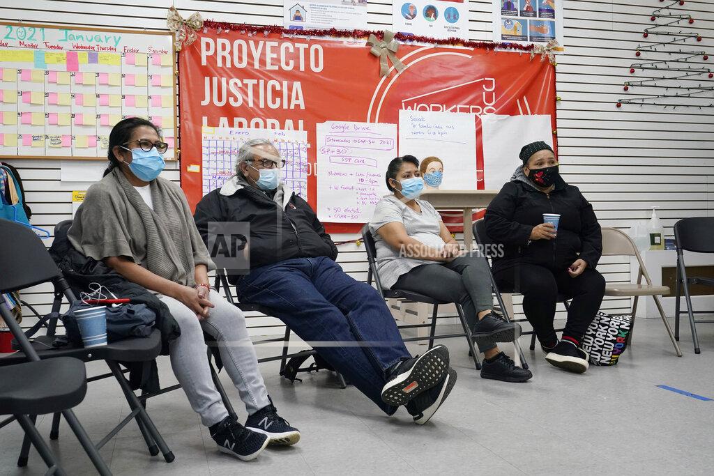 Kathy Willens A group of immigrants watch President Joe Biden's inauguration from the Workers Justice Center, Wednesday, Jan. 20, 2021, in the Sunset Park neighborhood of Brooklyn in New York. From left are Josefina Tapia, who is unemployed but used to be a housekeeper, Vicente Salvador, 74, Graciela Uraga, a cleaning lady, and Blanca Cedillos, who admitted she was "nervous" and disappointed when Biden didn't mention immigration reform in his speech. (AP Photo/Kathy Willens)