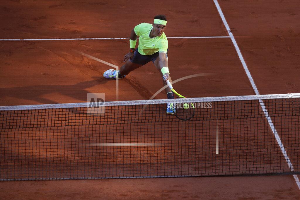 Michel Euler FILE- In this Friday May 31, 2019, image Spain's Rafael Nadal plays a shot against Belgium's David Goffin during their third round match of the French Open tennis tournament at the Roland Garros stadium in Paris. Sliding is one of the keys to success at the French Open, with the ability to glide along the ground to reach shots that others can't, is one of the skills that makes Rafael Nadal so successful on clay courts, although the French Open is postponed until September because of the coronavirus. (AP Photo/Michel Euler, File)