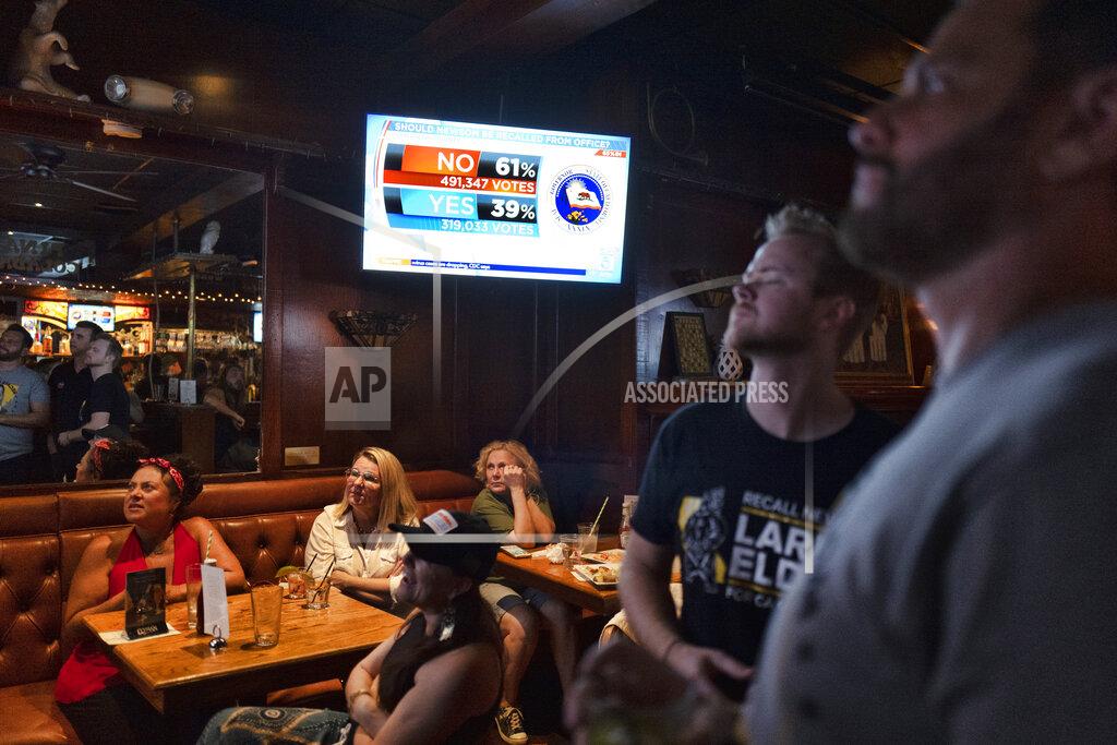 Richard Vogel A group of pro-recall voters gather to watch early results of the California Recall election during an election party at the Pineapple Hill Saloon & Grill in Los Angeles on Tuesday, Sept. 14, 2021. (AP Photo/Richard Vogel)