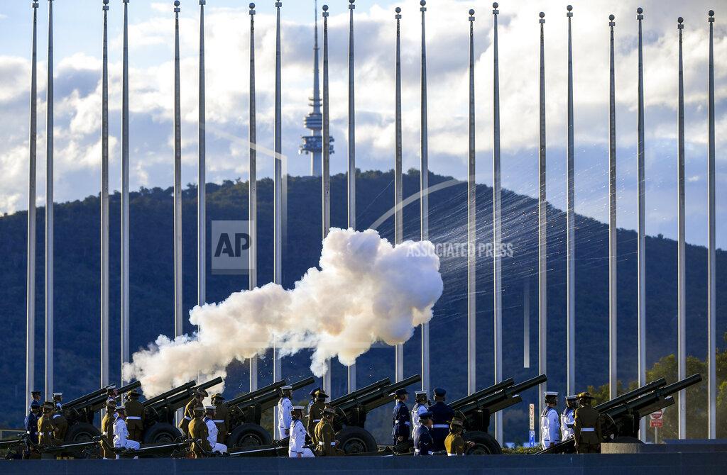 Lukas Coch The Australian Federation Guard fire a 41 gun salute to mark the passing of Prince Philip on the forecourt of Parliament House, in Canberra, Australia, Saturday, April 10, 2021. Prince Philip, the irascible and tough-minded husband of Queen Elizabeth II who spent more than seven decades supporting his wife in a role that mostly defined his life, has died, Buckingham Palace said Friday, April 9. He was 99. (Lukas Coch/AAP Image via AP)