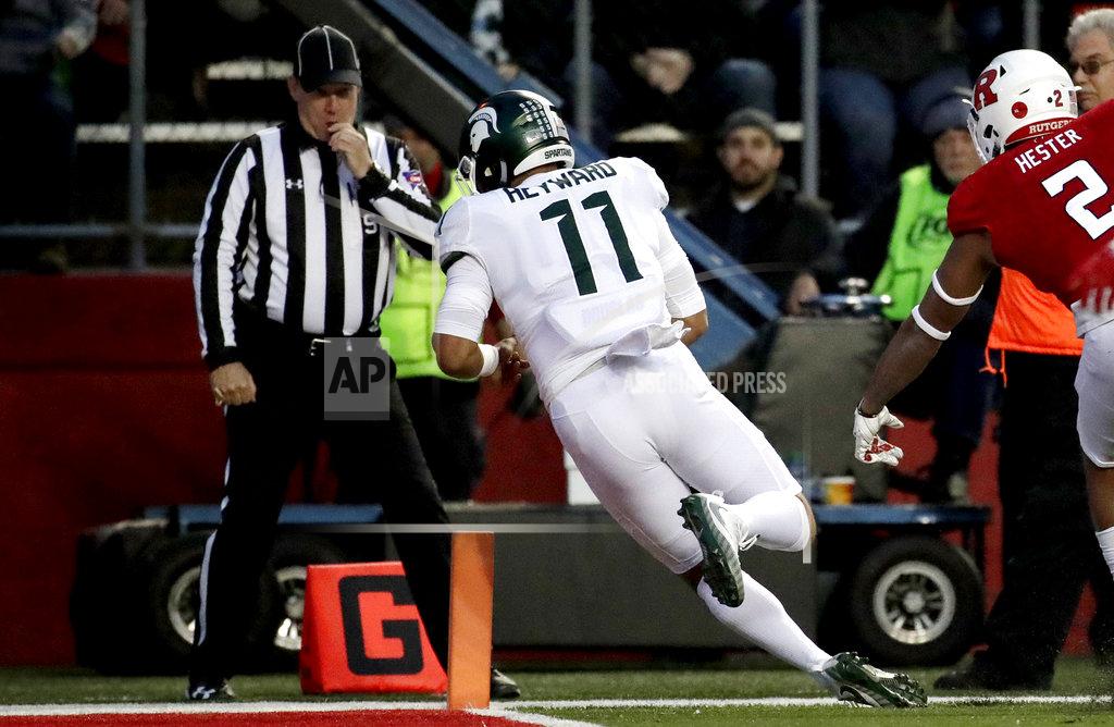 Julio Cortez Michigan State running back Connor Heyward dives in for a touchdown after making a catch on a pass from quarterback Brian Lewerke, not pictured, during the first half of an NCAA college football game against Rutgers, Saturday, Nov. 25, 2017, in Piscataway, N.J. (AP Photo/Julio Cortez)