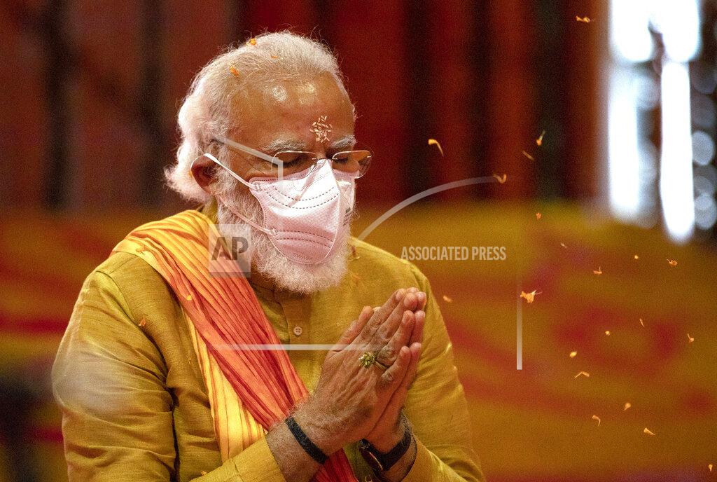 Rajesh Kumar Singh FILE- Indian Prime Minister Narendra Modi performs rituals during the groundbreaking ceremony of a temple dedicated to the Hindu god Ram, at the site of a demolished 16th century mosque, in Ayodhya, India on Aug. 5, 2020. Hindus believe the site of the mosque was the exact birthplace of their god Ram. Its demolition in 1992 sparked massive communal violence across India that left more than 2,000 people dead, mostly Muslims, and catapulted Prime Minister Narendra Modi's Bharatiya Janata Party to national prominence. (AP Photo/Rajesh Kumar Singh, File)