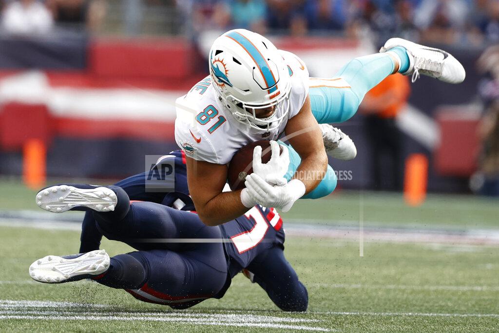Winslow Townson Miami Dolphins tight end Durham Smythe (81) hangs onto the ball while taken down by New England Patriots defensive back J.C. Jackson during the first half of an NFL football game, Sunday, Sept. 12, 2021, in Foxborough, Mass. (AP Photo/Winslow Townson)