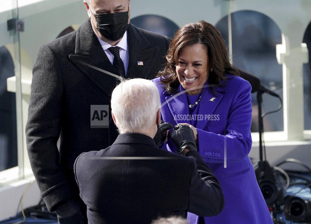 Greg Nash Vice President Kamala Harris bumps fists with President-elect Joe Biden after she was sworn in during the inauguration, Wednesday, Jan. 20, 2021, at the U.S. Capitol in Washington. (Greg Nash/Pool Photo via AP)