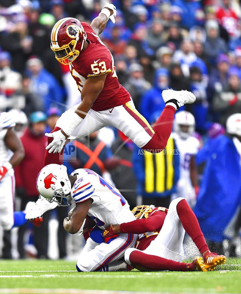 Adrian Kraus Buffalo Bills wide receiver John Brown (15) is tackled by cornerback Josh Norman (24) as Washington Redskins inside linebacker Jon Bostic (53) jumps over during the second half of an NFL football game, Sunday, Nov. 3, 2019, in Orchard Park, N.Y. (AP Photo/Adrian Kraus)