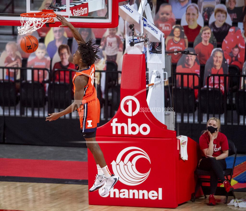 Francis Gardler Illinois' Ayo Dosunmu (11) dunks after a steal against Nebraska during the first half of an NCAA college basketball game on Friday, Feb. 12, 2021, in Lincoln, Neb. (Francis Gardler/Lincoln Journal Star via AP)