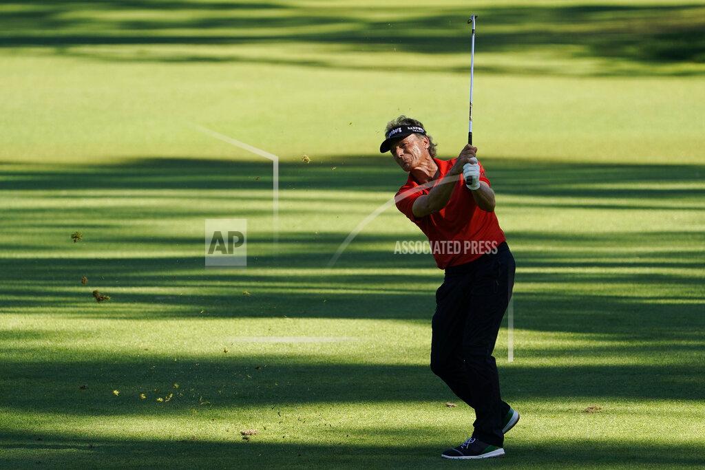 David J. Phillip Bernhard Langer, of Germany, hits on the 15th hole during the second round of the Masters golf tournament Friday, Nov. 13, 2020, in Augusta, Ga. (AP Photo/David J. Phillip)