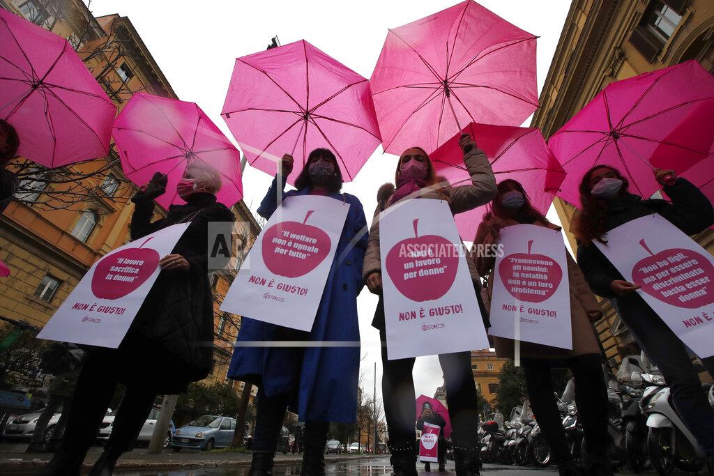 Alessandra Tarantino Women, wearing face masks to curb the spread of COVID-19, show banners and shout slogans during a demonstration in front of the Minister of Economy and Finance, to mark the International Women's Day, in Rome, Monday, March 8, 2021. Worldwide, working women paid a high price during the pandemic as many quit jobs to care for children when schools closed. But Italy's women went into the crisis already struggling for decades to expand their presence in the national workforce. Among the 27 European Union nations, Italian women rank next to the bottom, after Greek women, in terms of percentage in national workforces. Among young women, Italians rank the lowest. (AP Photo/Alessandra Tarantino)