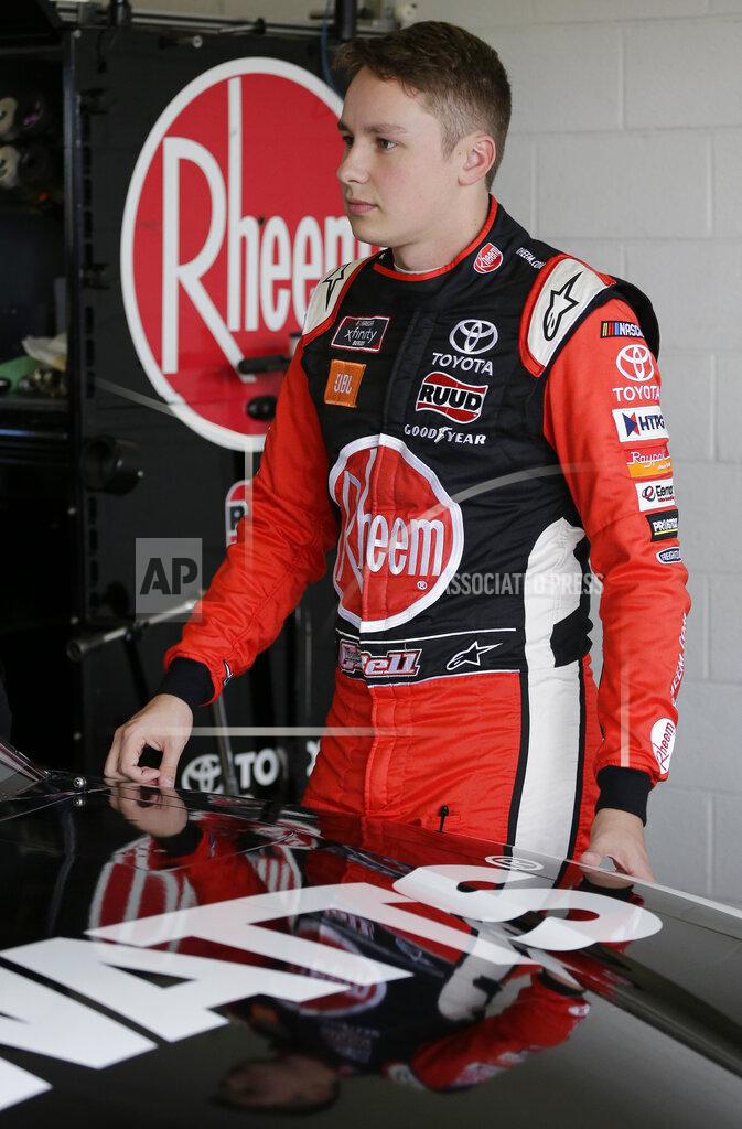 Terry Renna Christopher Bell stands by his car before a NASCAR Xfinity Series auto race practice on Friday, Nov. 15, 2019, at Homestead-Miami Speedway in Homestead, Fla. Bell is one of four drivers racing for the series championship. (AP Photo/Terry Renna)