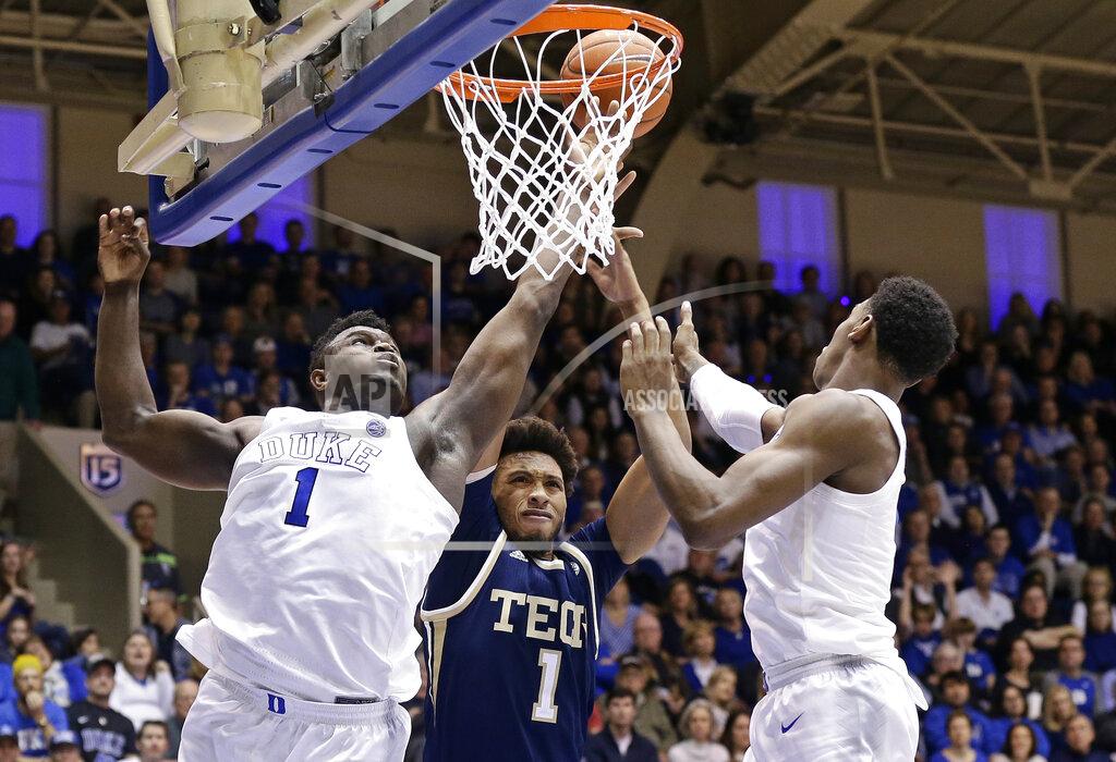 Gerry Broome Duke's Zion Williamson, left, and RJ Barrett reach for the ball with Georgia Tech's James Banks III (1) during the second half of an NCAA college basketball game in Durham, N.C., Saturday, Jan. 26, 2019. Duke won 66-53. (AP Photo/Gerry Broome)