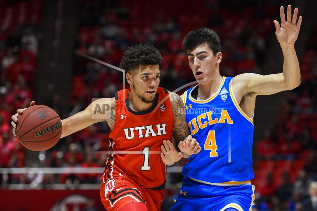 Alex Goodlett Utah forward Timmy Allen (1) drives as UCLA guard Jaime Jaquez Jr. (4) defends during the second half of an NCAA college basketball game Thursday, Feb. 20, 2020, in Salt Lake City. (AP Photo/Alex Goodlett)