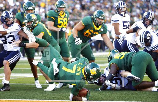 Baylor running back Abram Smith (7) dives for a touchdown against BYU during the second half of an NCAA college football game, Saturday, Oct. 16, 2021, in Waco, Texas. Baylor won 38-24. (AP Photo/Ron Jenkins)