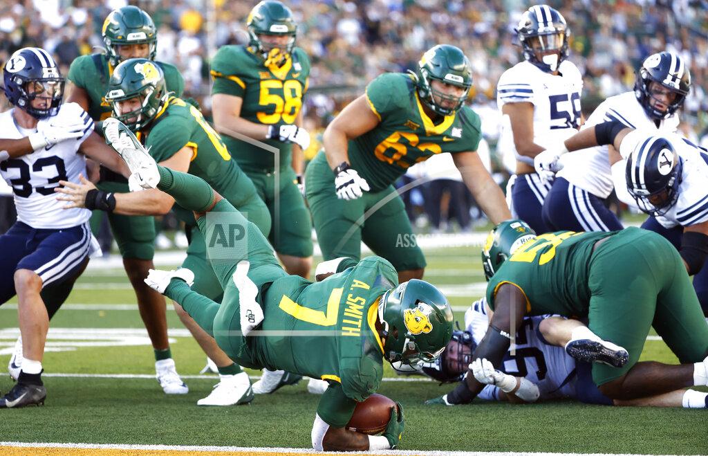 Ron Jenkins Baylor running back Abram Smith (7) dives for a touchdown against BYU during the second half of an NCAA college football game, Saturday, Oct. 16, 2021, in Waco, Texas. Baylor won 38-24. (AP Photo/Ron Jenkins)