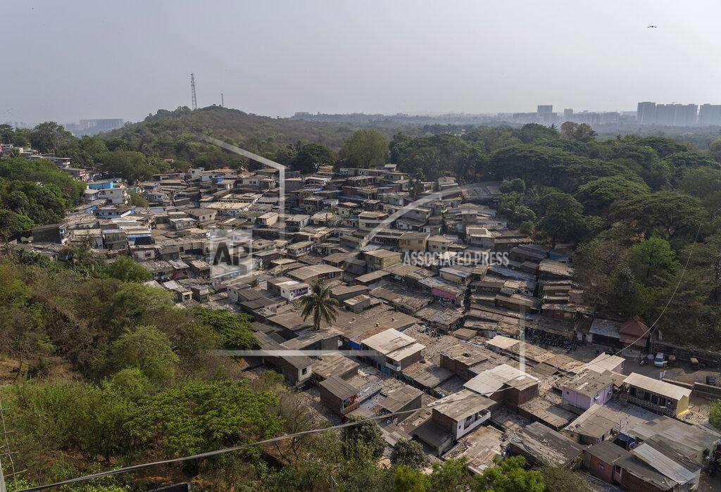 Rafiq Maqbool A view of the slum seen in the Aarey Colony which borders the south end of Sanjay Gandhi National Park in Mumbai, India, Wednesday, April 6, 2022. Los Angeles and Mumbai, India are the world’s only megacities of 10 million-plus where large felines breed, hunt and maintain territory within urban boundaries. Long-term studies in both cities have examined how the big cats prowl through their urban jungles, and how people can best live alongside them. (AP Photo/Rafiq Maqbool)