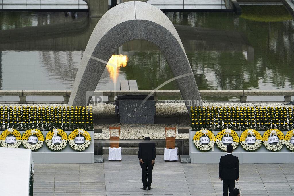Japanese Prime Minister Shinzo Abe bows in front of Hiroshima Memorial Cenotaph during a ceremony to mark the 75th anniversary of the bombing at the Hiroshima Peace Memorial Park Thursday, Aug. 6, 2020, in Hiroshima, western Japan. (AP Photo/Eugene Hoshiko)