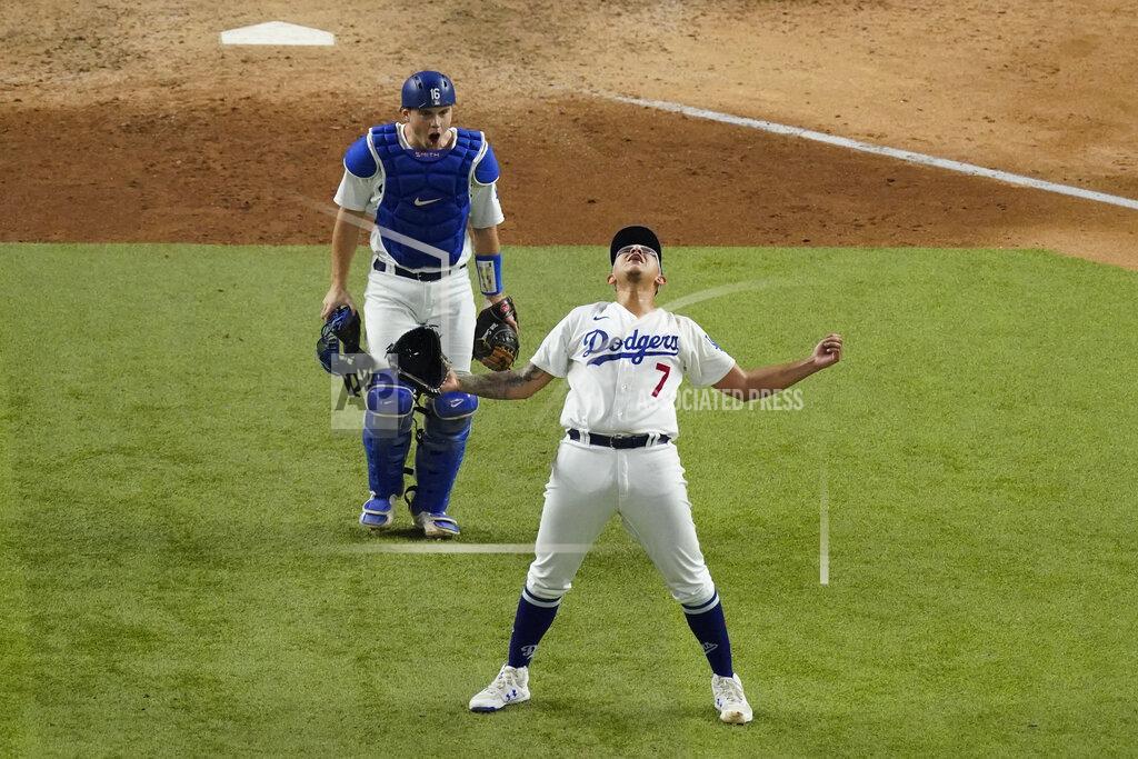 Sue Ogrocki Los Angeles Dodgers starting pitcher Julio Urias celebrates their win against the Atlanta Braves in Game 7 of a baseball National League Championship Series Sunday, Oct. 18, 2020, in Arlington, Texas. (AP Photo/Sue Ogrocki)