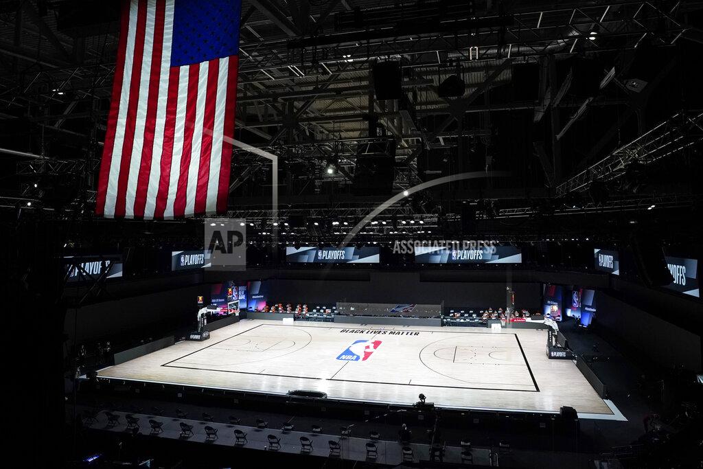 Ashley Landis The court sits empty after a postponed NBA basketball first round playoff game between the Milwaukee Bucks and the Orlando Magic, Wednesday, Aug. 26, 2020, in Lake Buena Vista, Fla. The game was postponed after the Milwaukee Bucks didn't take the floor in protest against racial injustice and the shooting of Jacob Blake, a Black man, by police in Kenosha, Wisconsin. (AP Photo/Ashley Landis, Pool)